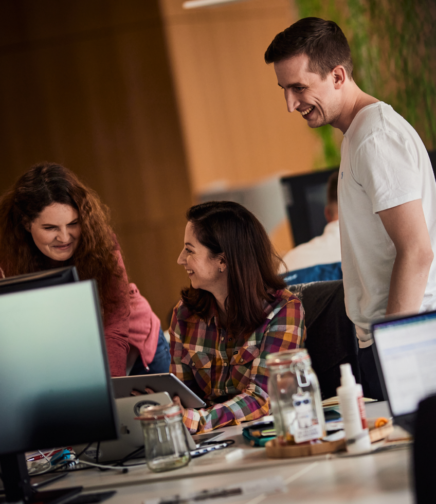 Employees collaborating in the office during a team discussion