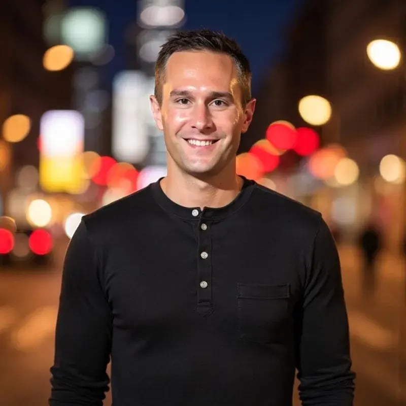Profile shot of Joe Joy, Pricefx Chief of Staff to the CEO, against a deliberately blurred cityscape