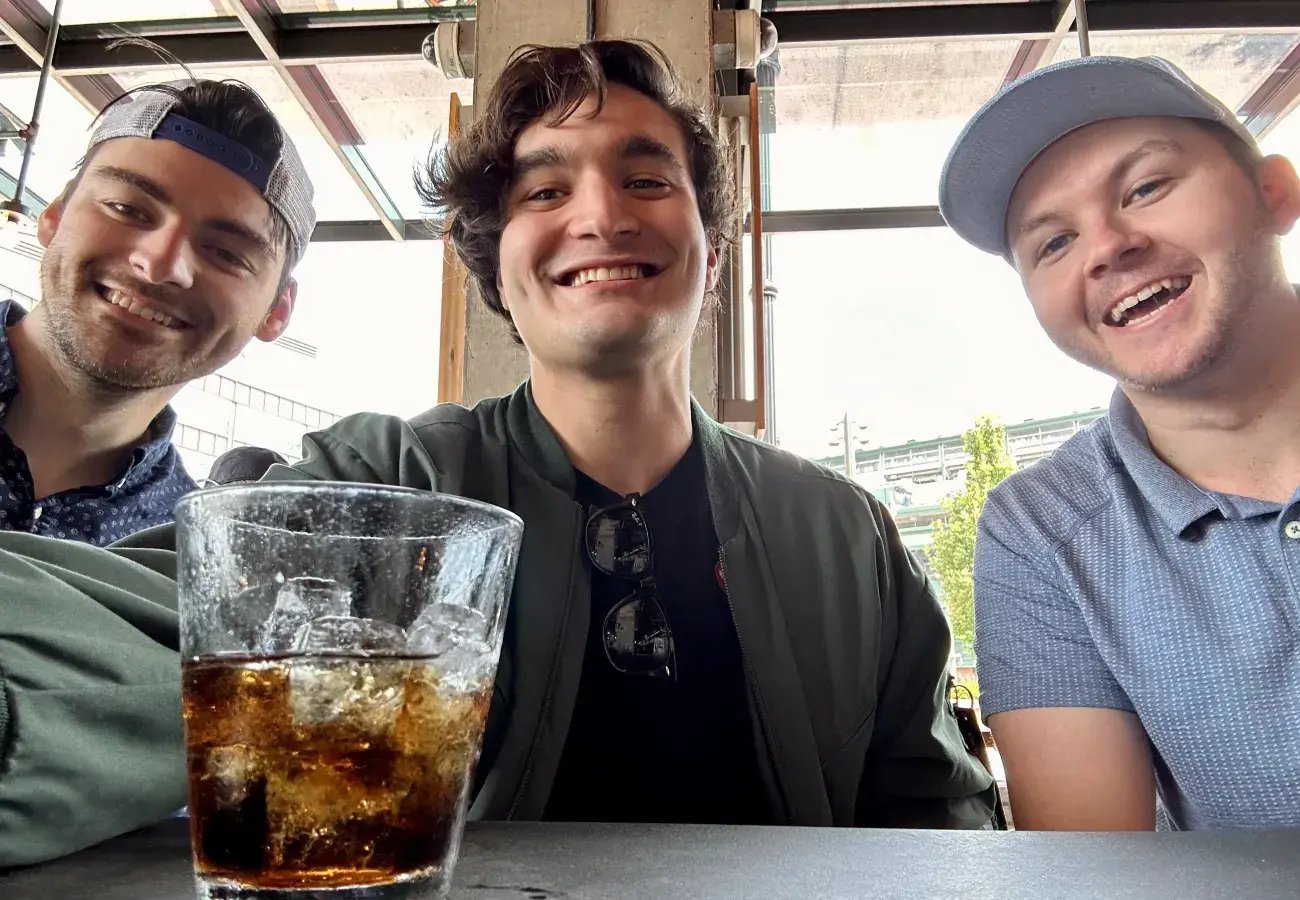 Three Pricefx support engineers enjoying a drink