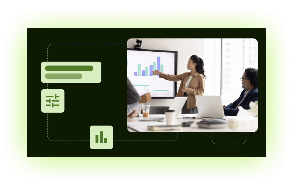 Presenter explaining a bar chart to colleagues in a meeting room