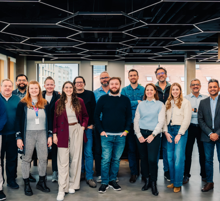 Pricefx team standing in a modern office, showing collaborative workplace culture