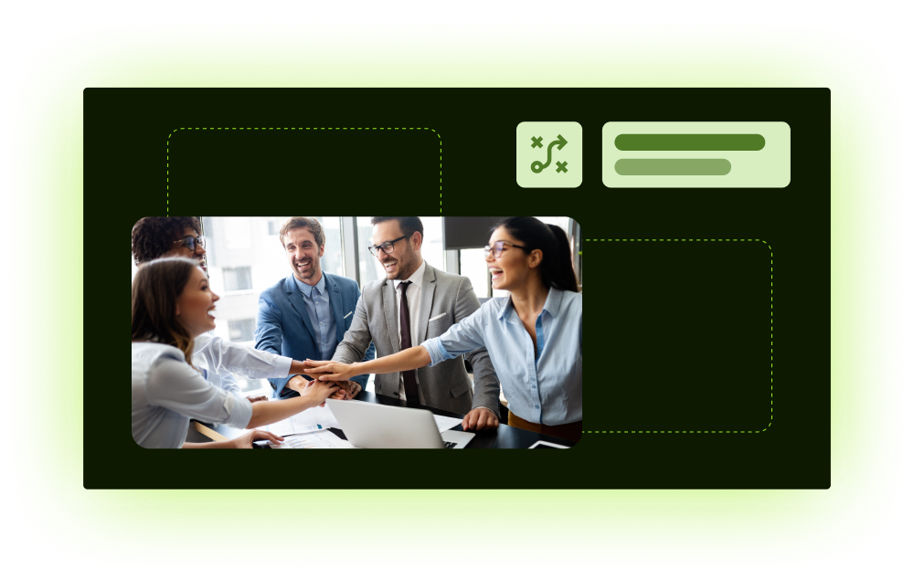 Team stacking hands over laptop in collaborative office meeting