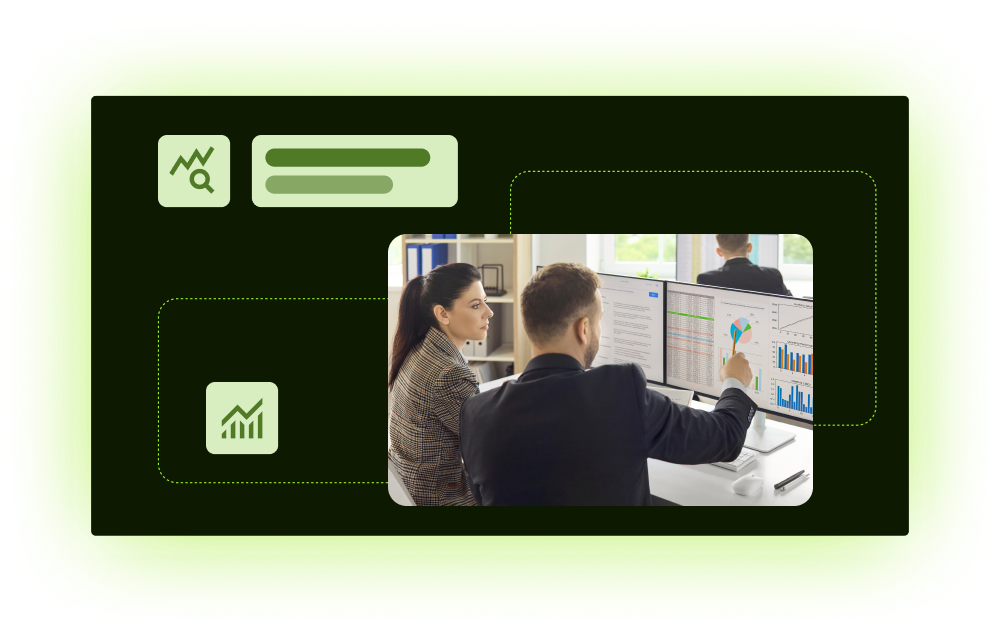Two analysts reviewing charts on desktop monitors in branded layout