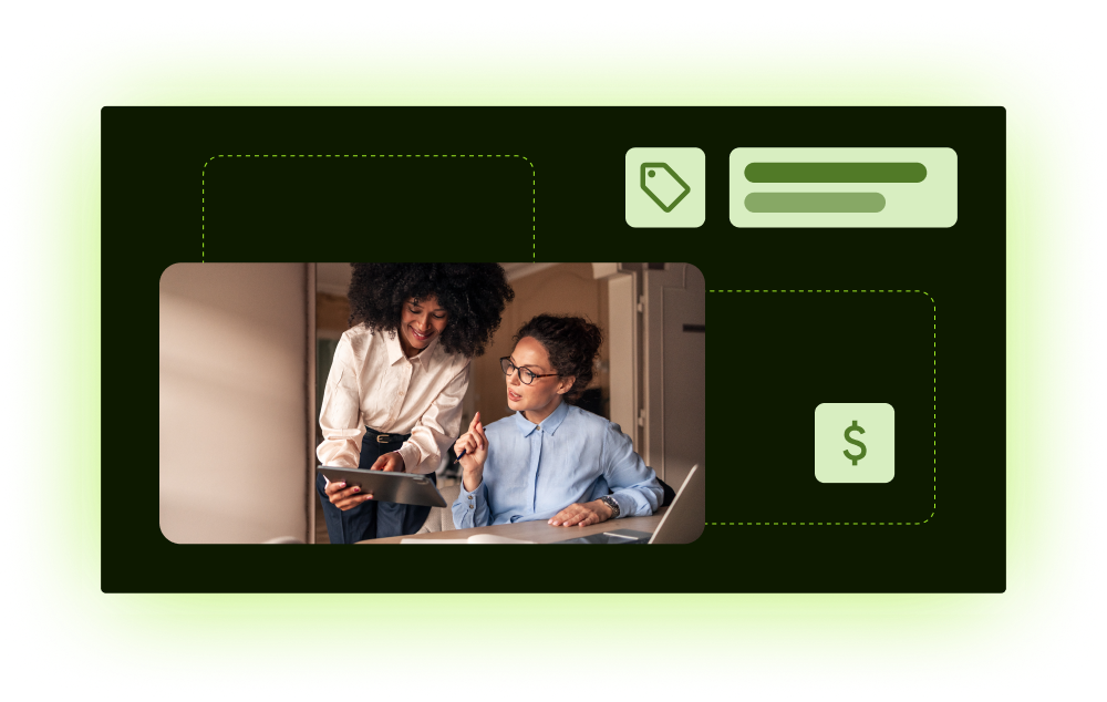 Two colleagues reviewing a tablet with pricing and dollar icons