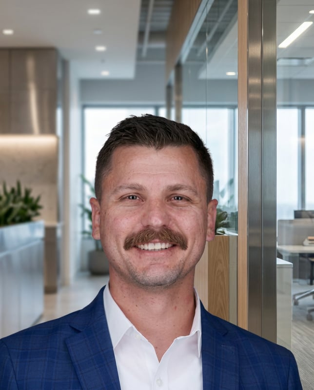 Jacob Childerson smiling in a professional portrait in the office