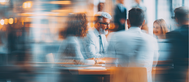 Colleagues in discussion during a business meeting