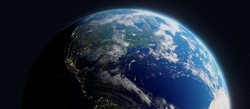 Earth from space with the Americas in view, half lit by sunlight