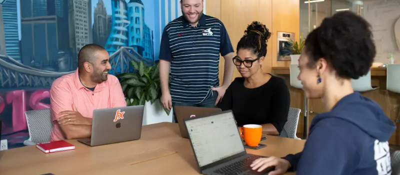 Pricefx employees in meeting laughing