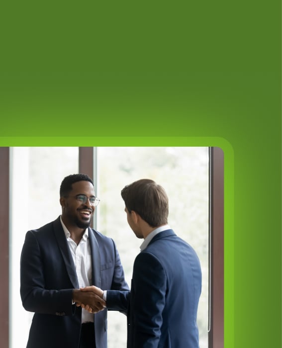 Two professionals shaking hands during a business meeting