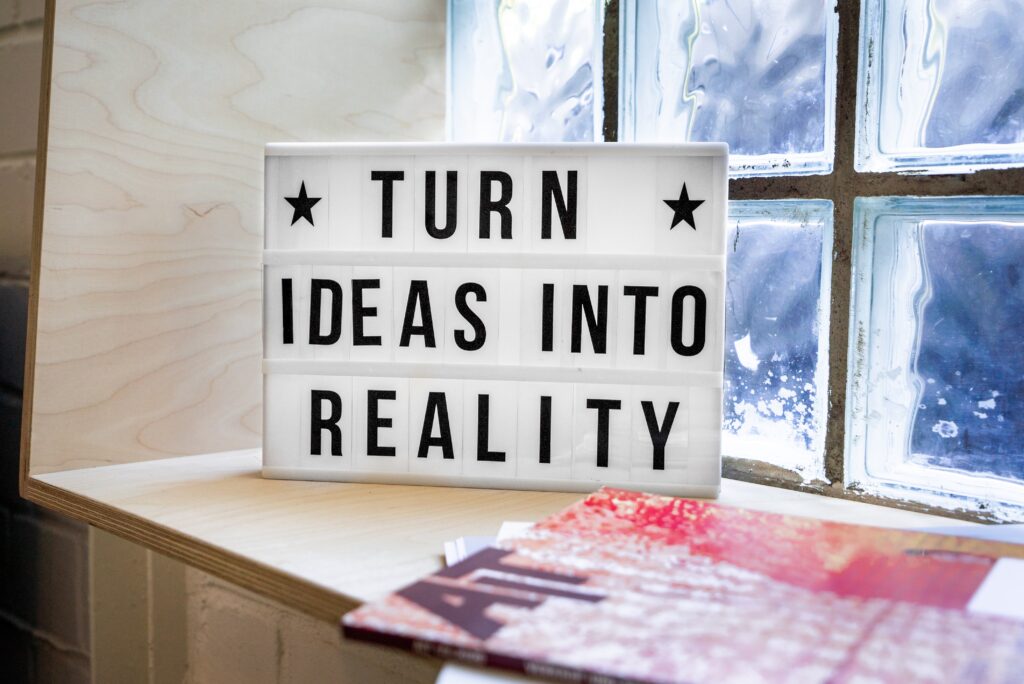 Turn-Ideas-Into-Reality-Sign-In-A-Window-Sill
