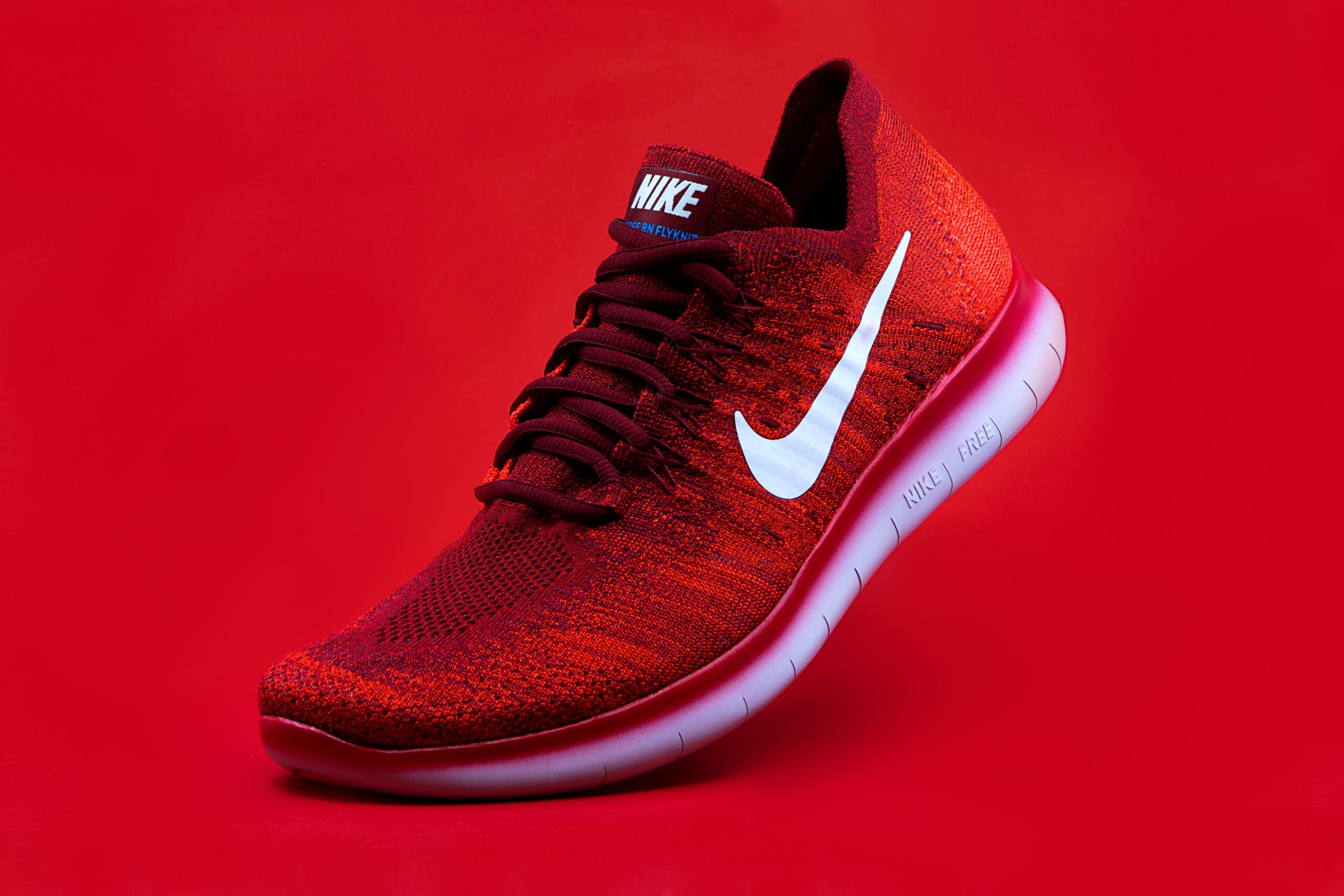 Nike-Red-Running-Shoe-On-A-Red-Background