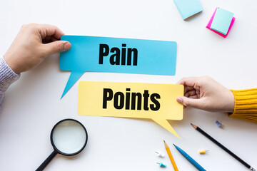 Pain-Points-Printed-On-Sticky-Notes-On-Desk