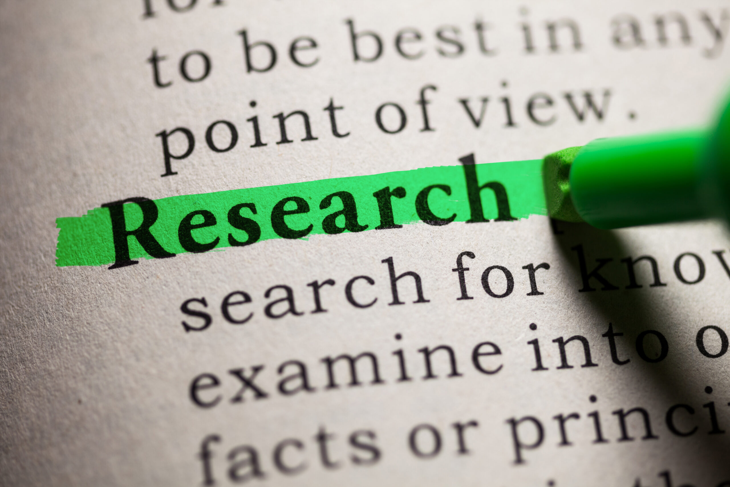 Research-highlighted-in-green-on-page-of-other-unhighlighted-words