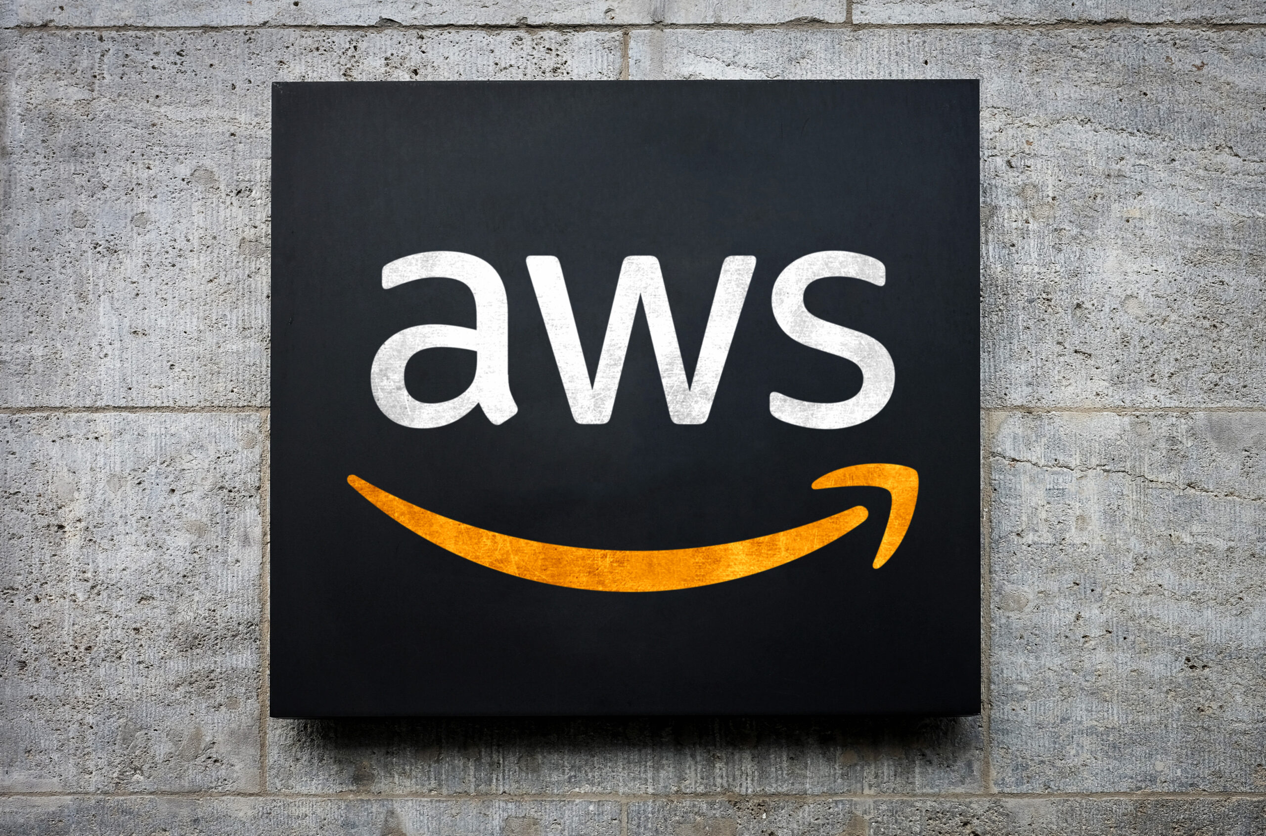 AWS-Logo-on-a-plain-brick-background