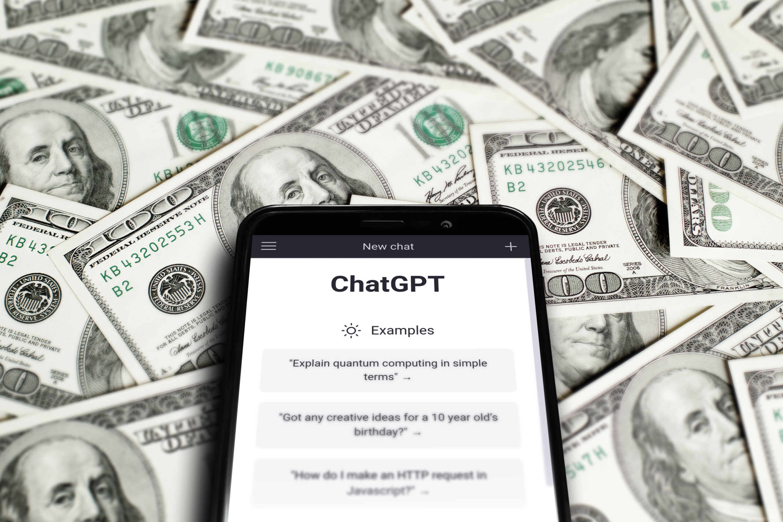 ChatGPT-Open-on-a-smartphone-surrounded-by-100-bills