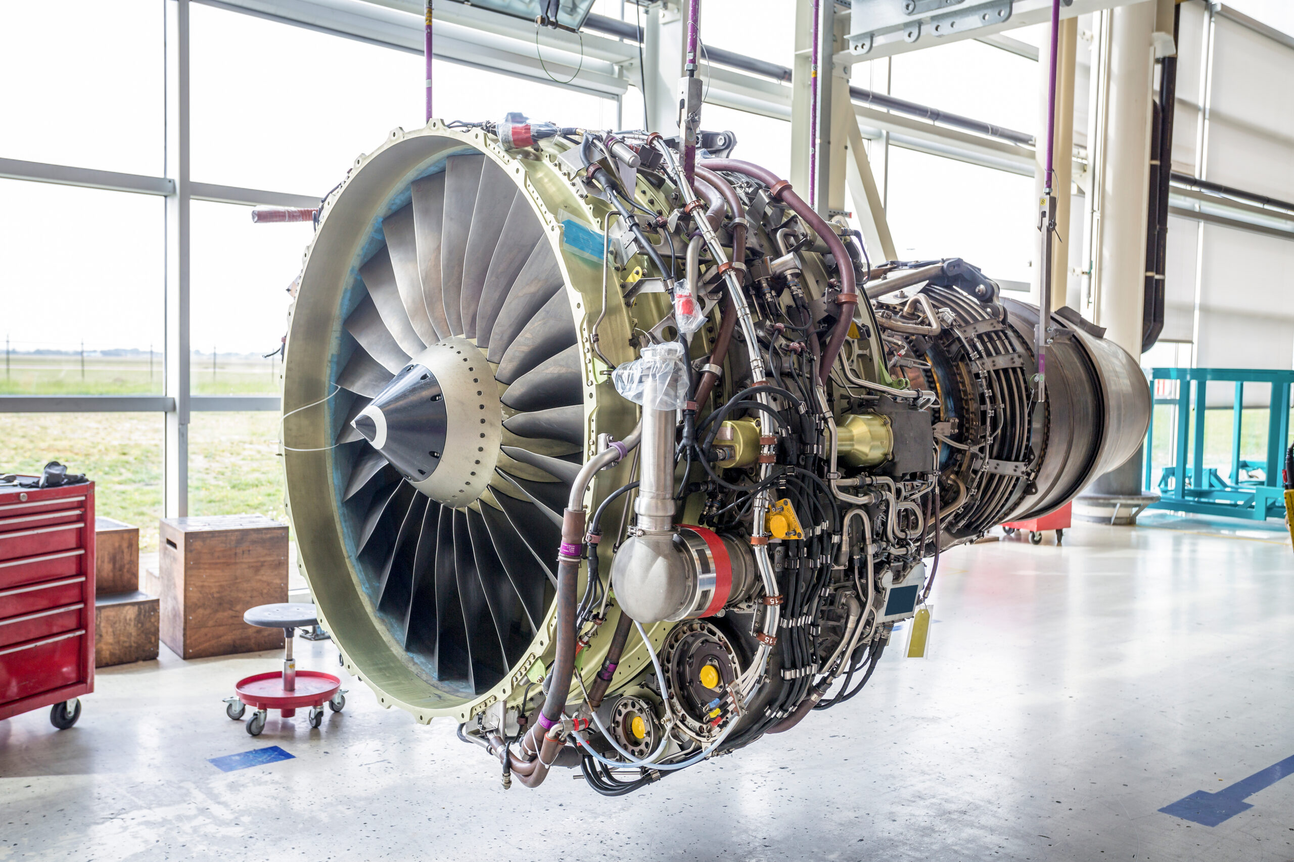 Jet-Engine-Being-Assembled-or-Serviced-Hanging-from-Girders
